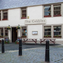 COBBLES INN Logo